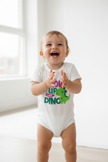 Toddler wearing white Baby Creator DINO bodysuit